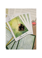 Card with illustration of a mole on a swing and text 'March' on a textured surface.