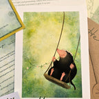 Illustration of a mole on a swing with a floral headband against a green background.